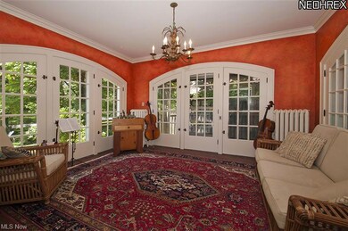 Sunny family room with arched French doors all aro