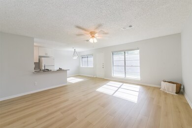 Spacious den is open, light and bright.