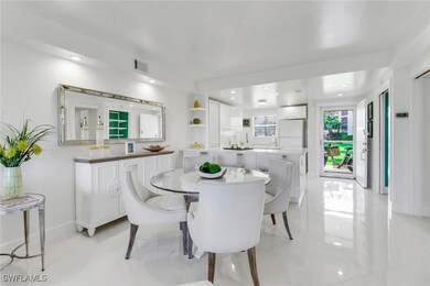 Dining space with light tile patterned flooring an