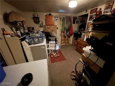 Basement with washer / clothes dryer