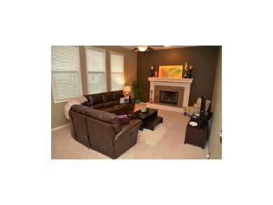 Great Room with a cozy, wood-burning fireplace and