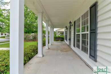 Long covered porch with swing, perfect for coffee 