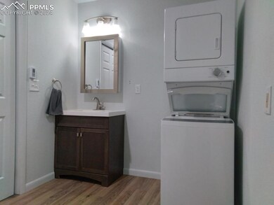 Bathroom with vanity, hardwood / wood-style floori