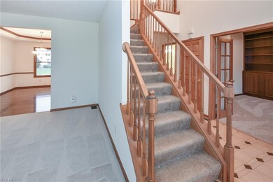 Wood Staircase With Newer Carpeting.