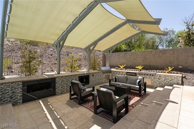 Outdoor kitchen with fireplace, sitting area, buil