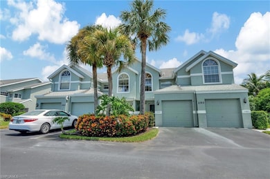 View of property with driveway, stucco siding, and