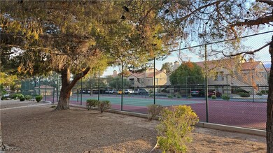View of tennis court with fence