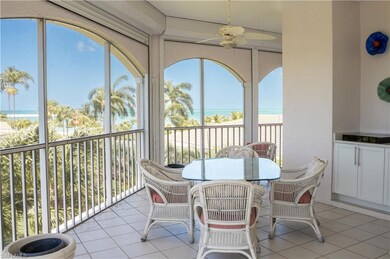Sunroom / solarium with a water view and ceiling f