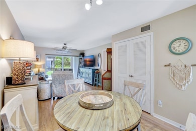 Dining room featuring light wood-style flooring and ceiling fan