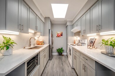 The skylight in the kitchen provides plenty of nat