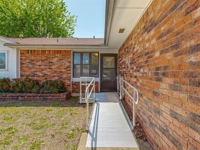 Entrance to property featuring roof with shingles 