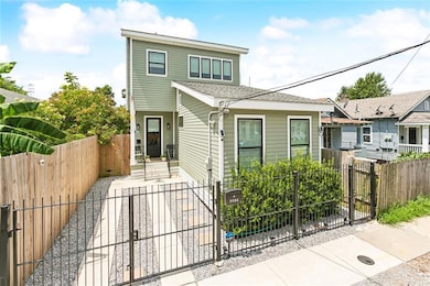 Gated off-street parking. Passenger gate on the right for income suite entrance. Qualifies for 100% financing as well.