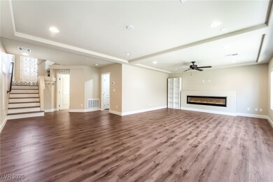 Unfurnished living room with a ceiling fan, recess