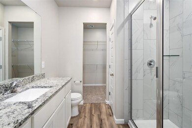 The master retreat features its own walk-in closet!