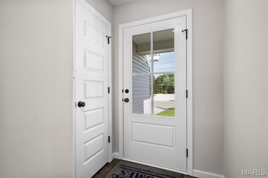 Entryway featuring baseboards