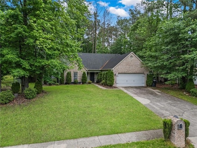 View of front of home featuring a garage, a front 