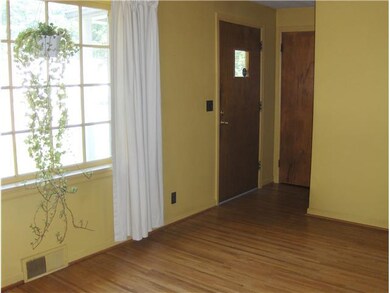 Living Room Front door entrance with guest closet