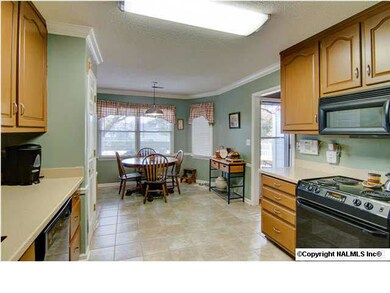 Beautifully refinshed cabinets with new brushed nickel hardware. New corian countertops and new tile floor.