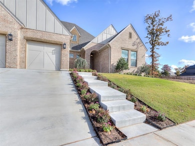 View of front of house with a front yard and a gar