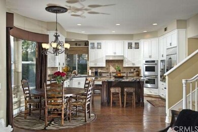 gourmet kitchen open to breakfast nook as well as 