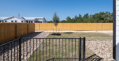 View of fenced backyard