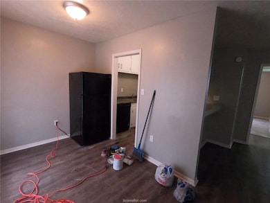 Unfurnished bedroom with baseboards, freestanding