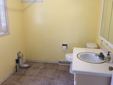 Laundry area includes 1/2 bath.  Just off the kitc