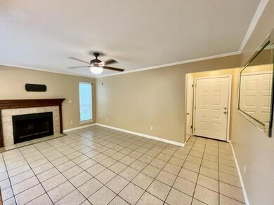 Living room w/ wood burning fireplace