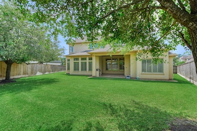 This photo showcases a spacious backyard with a lu