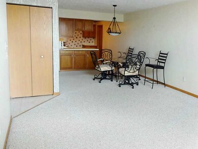 Dining Room. Open floor plan connects the Living Room to the Dining Room.  The combined length of this neutral decorated combo is 28 feet.