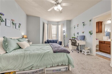 Bedroom featuring carpet flooring and ceiling fan