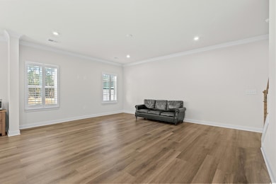 Sitting room featuring light wood-type flooring, p