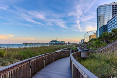Surrounding community with view of water and beach