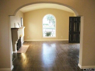Beautiful decorative archway leading into living room.