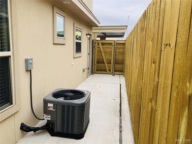 View of property exterior with central AC, fence, and stucco siding
