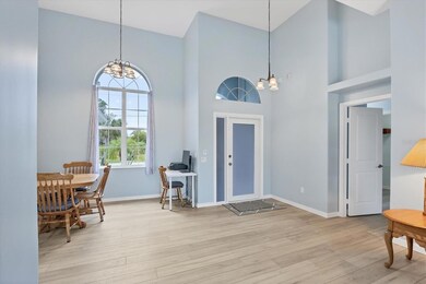 New Front Entrance Door, Dining area, sitting room and door into Primary Bedroom Suite.