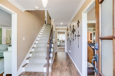 Step inside to a foyer filled with warmth and natural light.