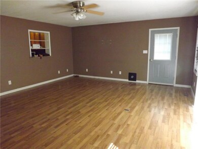17 X 19 FAMILY ROOM WITH BEAUTIFUL LAMINATE FLOOR.