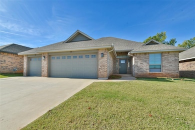 Ranch-style home featuring a shingled roof, brick siding, a front lawn, a garage, and concrete driveway