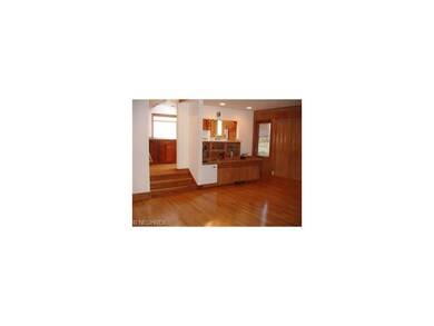 Den with wet bar (granite top) and beautiful oak p