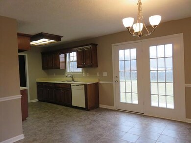 Huge Dining Area and open kitchen with stove, DW, and microwave.