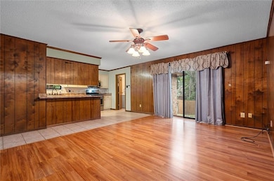 Unfurnished living room with a textured ceiling, w