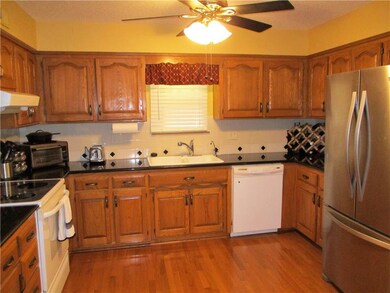 There's hardwood floors, granite counters and stai