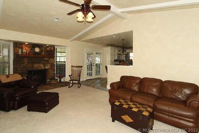 Main living area features a vaulted ceiling and fi