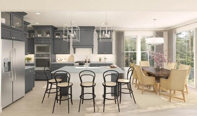 Kitchen with island, pendant lighting and glass-front upper cabinets