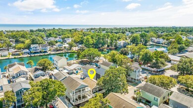 Aerial view featuring a water view and a residenti