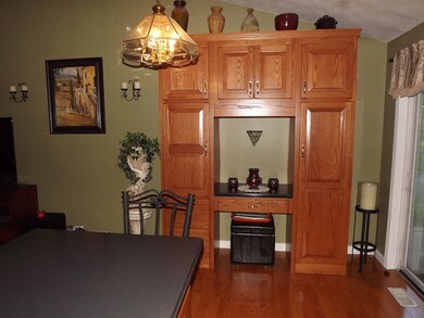 Additional wall of cabinets adds beauty and functi
