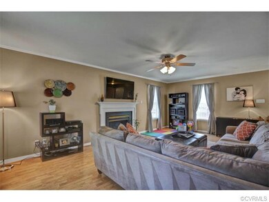 Updated floors, ceiling fan complete this living r