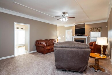Large living room complete with a fireplace.