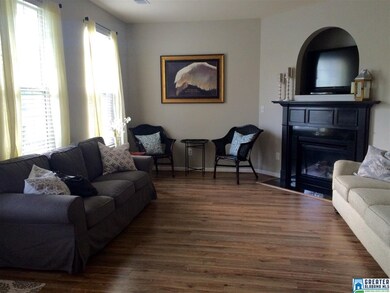 Beautiful hardwood laminate and gas fireplace with